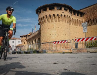 Cyclist going on a rented bike in Ceriva during Ironman Event in Emilia Romagna